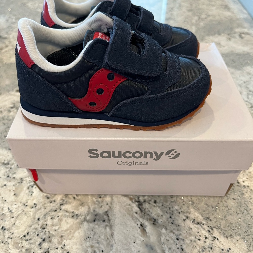 Never worn Saucony Toddler shoes. Size5 1/2 M Navy/Red
